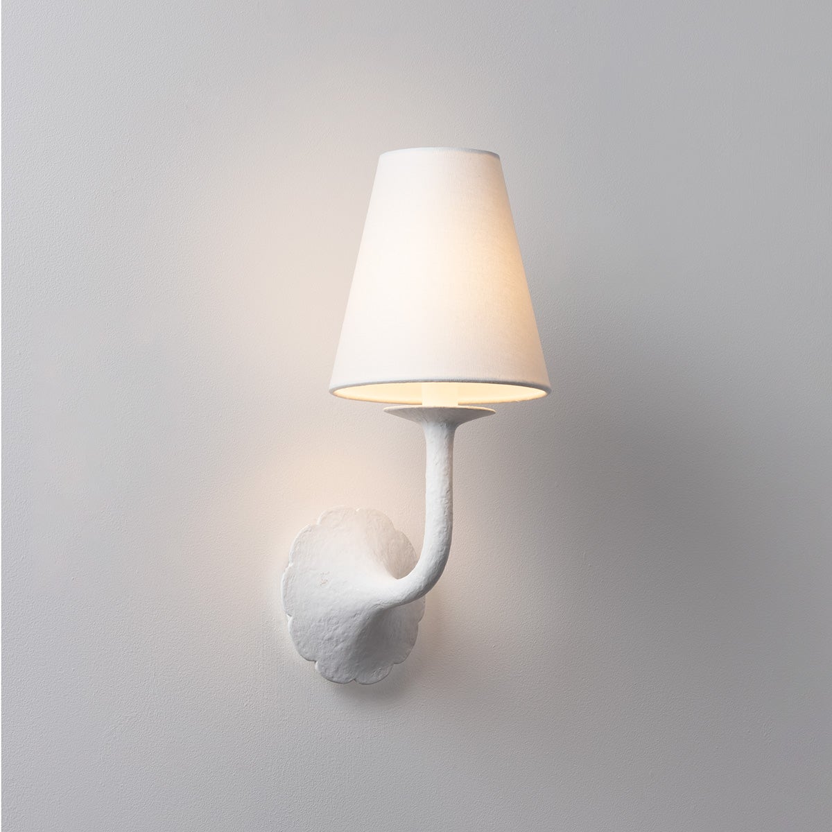 Close-up of the Winnipeg Wall Sconce showing the arm curve and shade silhouette.