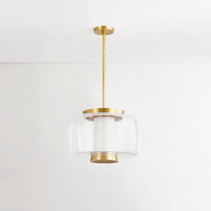 Beau Pendant 20" in aged brass shown from the front to reveal the shade shape and metal detail.