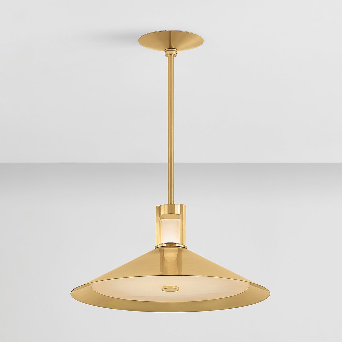 Close-up of the Clermont Pendant 20" in aged brass showing the shade shape and metal detail.
