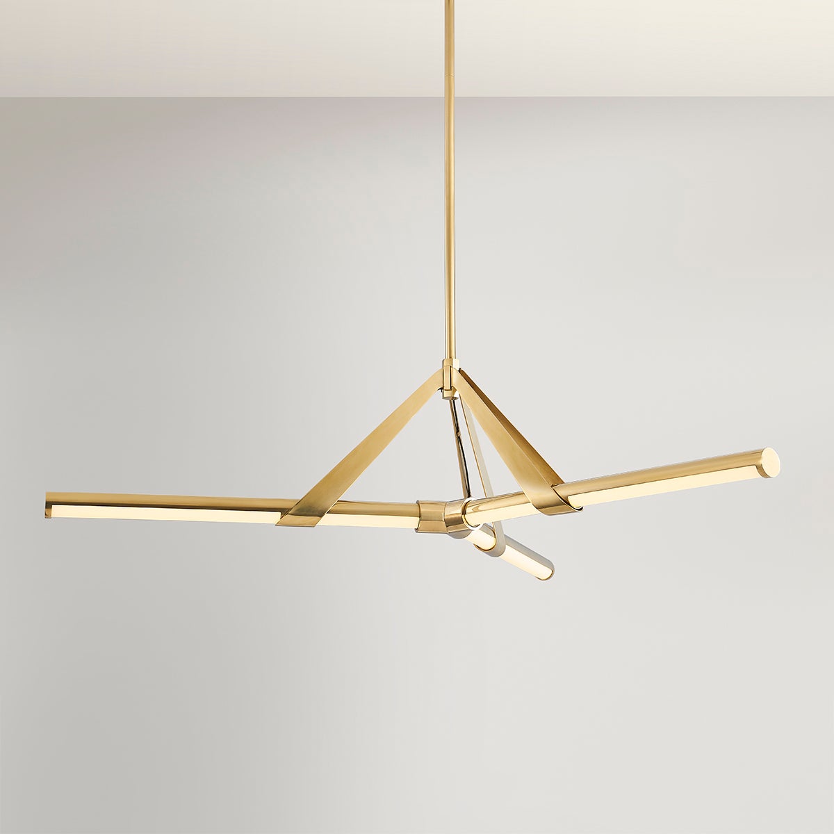 Close-up of the Jonas Chandelier 46" in aged brass showing the frame, arms, and shade detail.