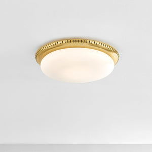 North Castle Flush Mount 14.25" in aged brass shown from the front to reveal the shade profile and mounting canopy.