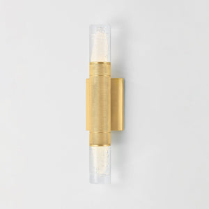 Glen Cove Wall Sconce in aged brass shown from the front to reveal the arm curve and shade silhouette.