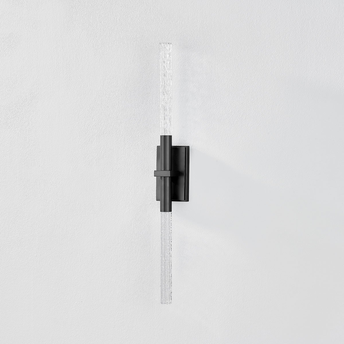 Close-up of the Millerton Wall Sconce showing the arm curve and shade silhouette.