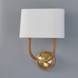 Webson Wall Sconce in aged brass shown from a second angle to highlight the arm curve and shade silhouette.