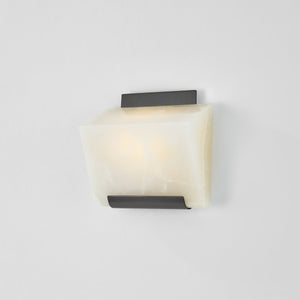Close-up of the Fairfield Wall Sconce in bronze showing the arm curve and shade silhouette.