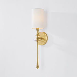 Close-up of the Guilford Wall Sconce in aged brass showing the arm curve and shade silhouette.