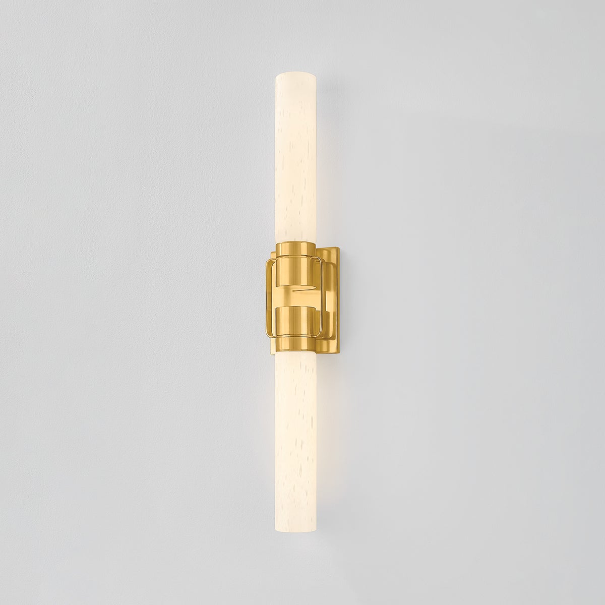 Close-up of the Glen Oaks Wall Sconce in aged brass showing the arm curve and shade silhouette.