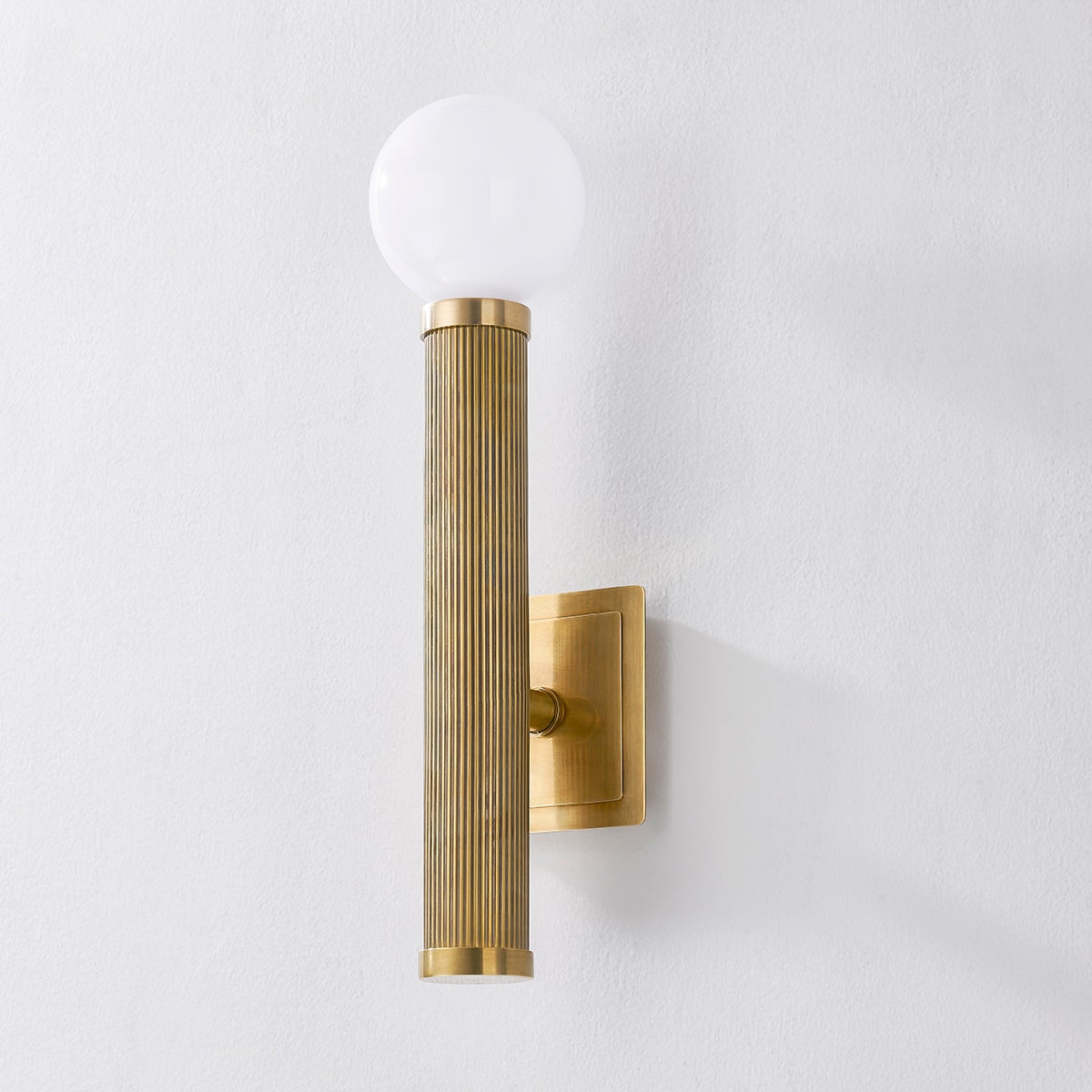 Pienza Wall Sconce 5.5" x 20" shown from the front to reveal the arm curve and shade silhouette.