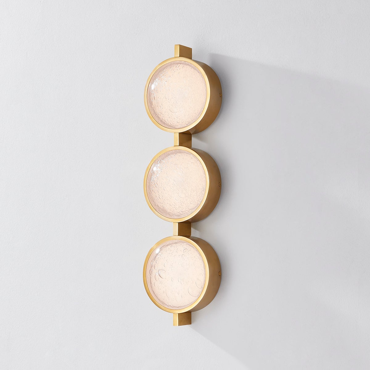 Ansonia Wall Sconce shown from the front to reveal the arm curve and shade silhouette.