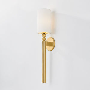 Close-up of the Lakeport Wall Sconce in aged brass showing the arm curve and shade silhouette.