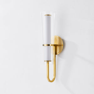 Vancouver Wall Sconce in aged brass shown from the front to reveal the arm curve and shade silhouette.