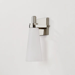 Close-up of the Trude Wall Sconce in polished nickel showing the arm curve and shade silhouette.