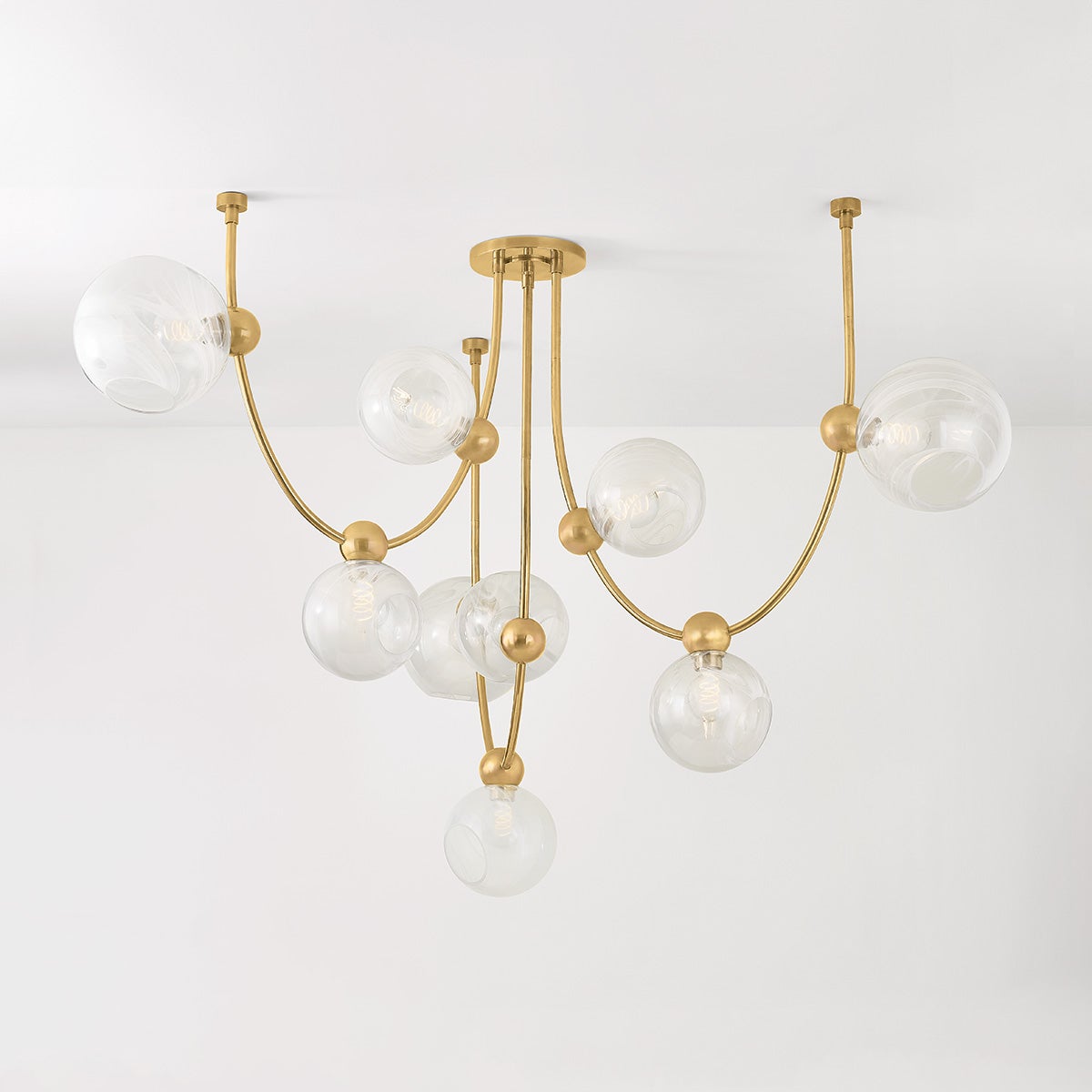 Close-up of the Astraia Chandelier showing the frame, arms, and shade detail.
