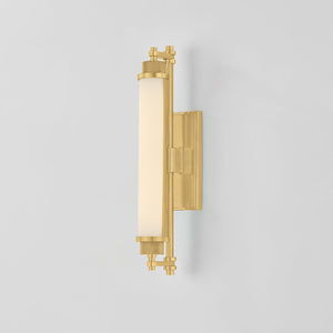 Close-up of the Plandome Bath And Vanity 4.25" x 18" in aged brass showing the arm spread and shade silhouette.