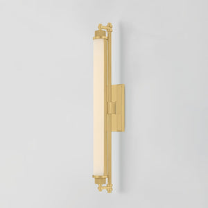 Close-up of the Plandome Bath And Vanity 4.25" x 28" in aged brass showing the arm spread and shade silhouette.