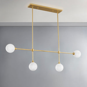 Andrews Linear in aged brass shown from a second angle to highlight the extended frame and shade array.