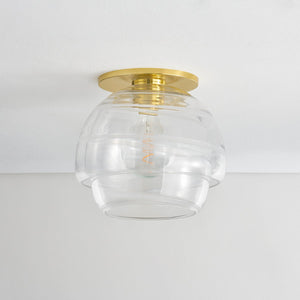 Montvale Flush Mount in aged brass shown from a second angle to highlight the shade profile and mounting canopy.