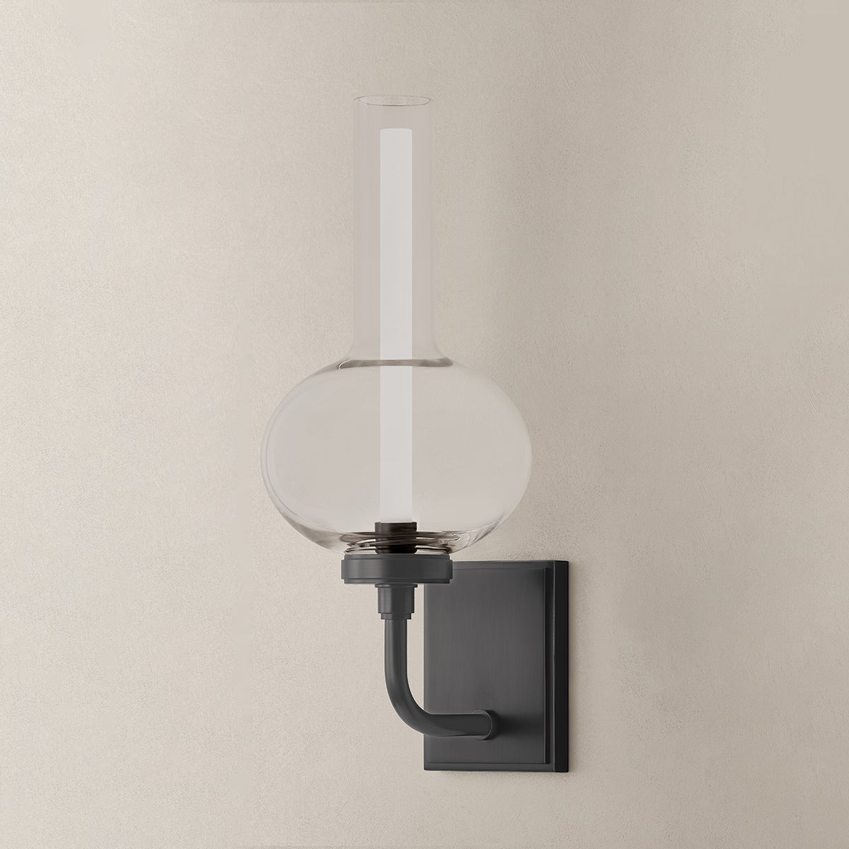 Close-up of the Rossman Wall Sconce in dark bronze showing the arm curve and shade silhouette.