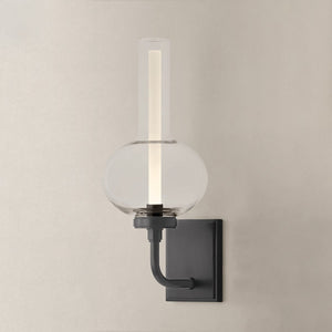 Close-up of the Rossman Wall Sconce in dark bronze showing the arm curve and shade silhouette.