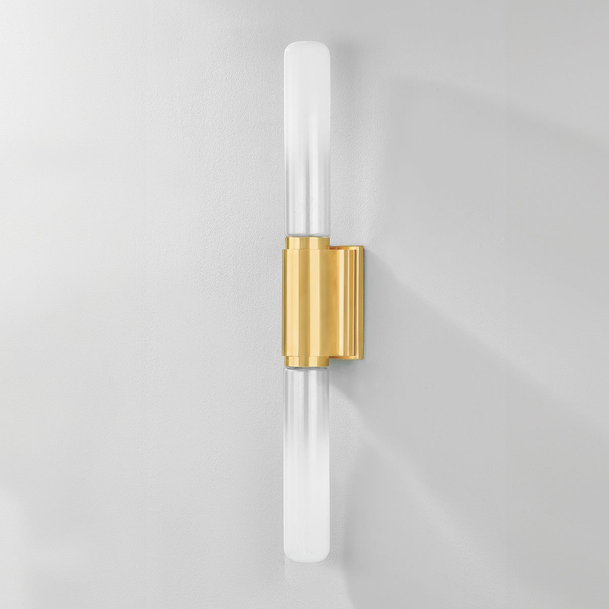 Colrain Wall Sconce 5.25" x 31.75" in aged brass shown from the front to reveal the arm curve and shade silhouette.