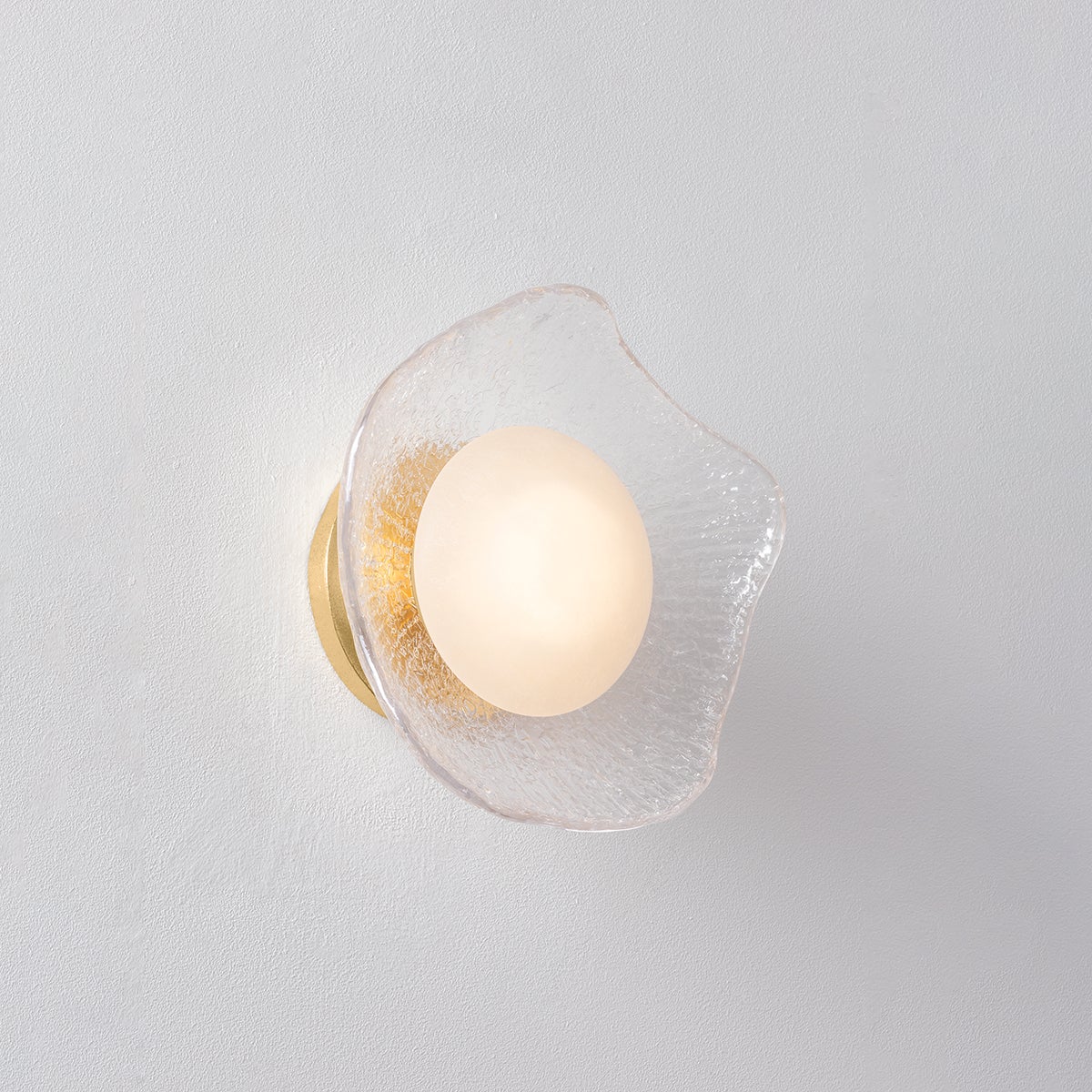 Almandine Wall Sconce shown from the front to reveal the arm curve and shade silhouette.
