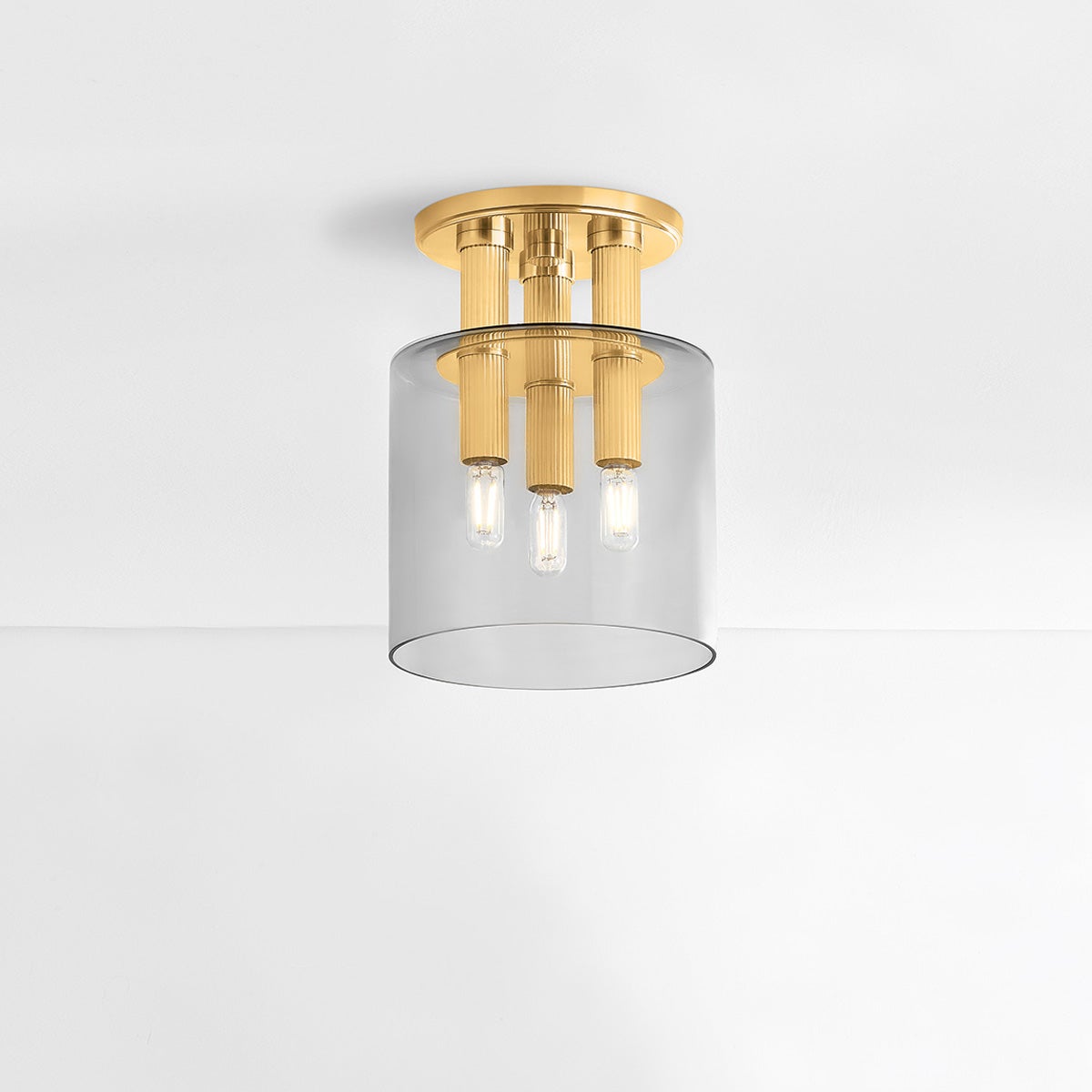 Crystler Flush Mount 8.5" in aged brass shown from the front to reveal the shade profile and mounting canopy.