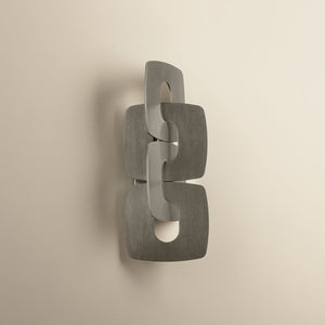 Close-up of the Trentino Wall Sconce showing the arm curve and shade silhouette.
