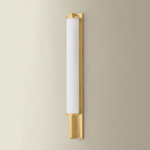 Northfield Wall Sconce 2.75" in aged brass shown from a second angle to highlight the arm curve and shade silhouette.