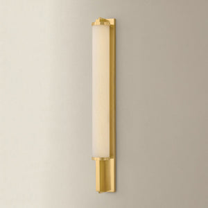 Northfield Wall Sconce 2.75" in aged brass shown from the front to reveal the arm curve and shade silhouette.