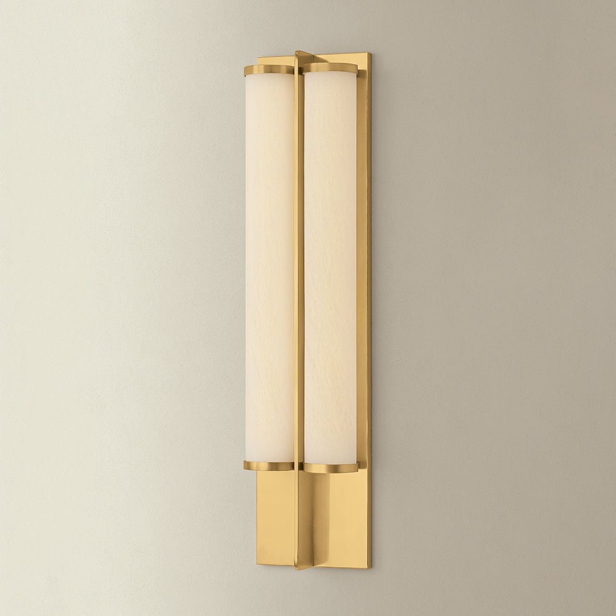 Northfield Wall Sconce 5.5" in aged brass shown from the front to reveal the arm curve and shade silhouette.