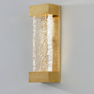 Close-up of the Wharton Wall Sconce 5" x 15" in aged brass showing the arm curve and shade silhouette.