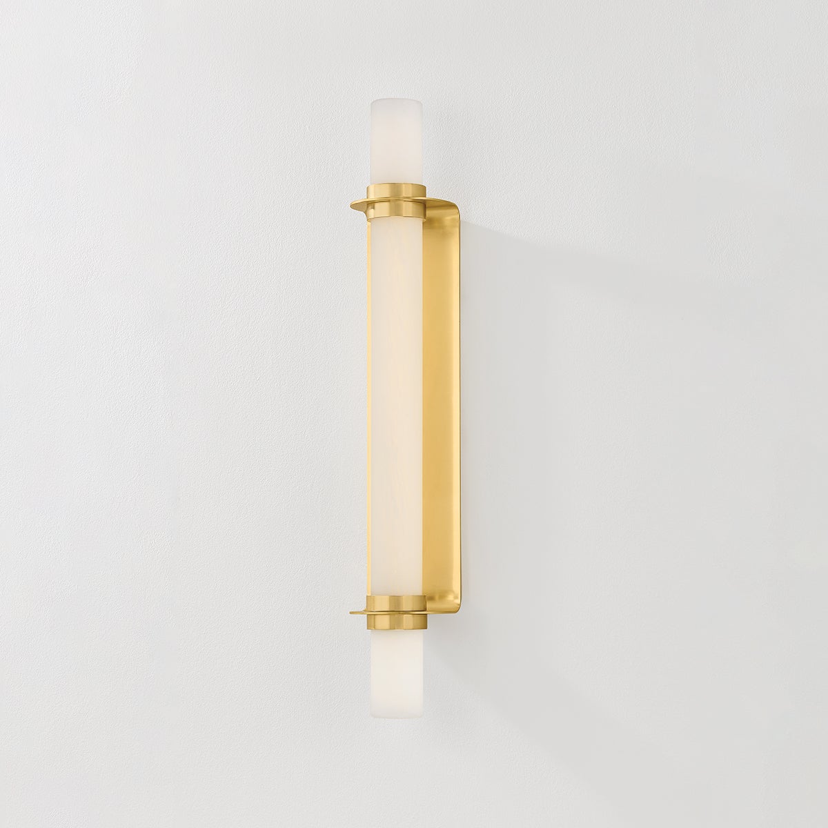 Groveland Station Wall Sconce 4.75" x 27.75" in aged brass shown from the front to reveal the arm curve and shade silhouette.