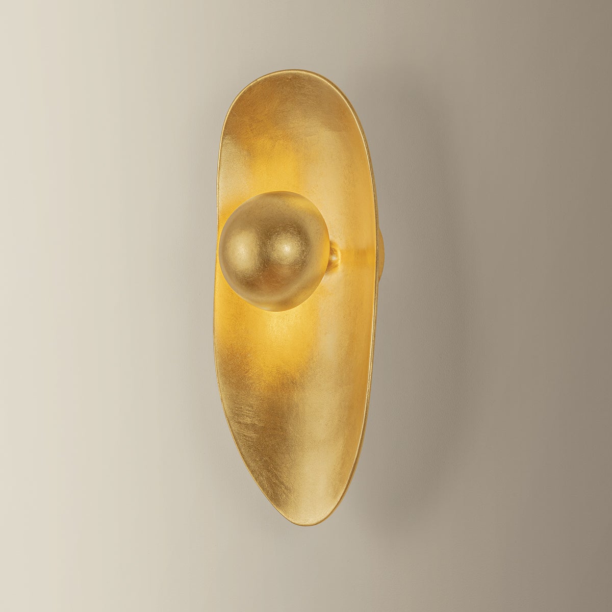 Meena Wall Sconce shown from the front to reveal the arm curve and shade silhouette.
