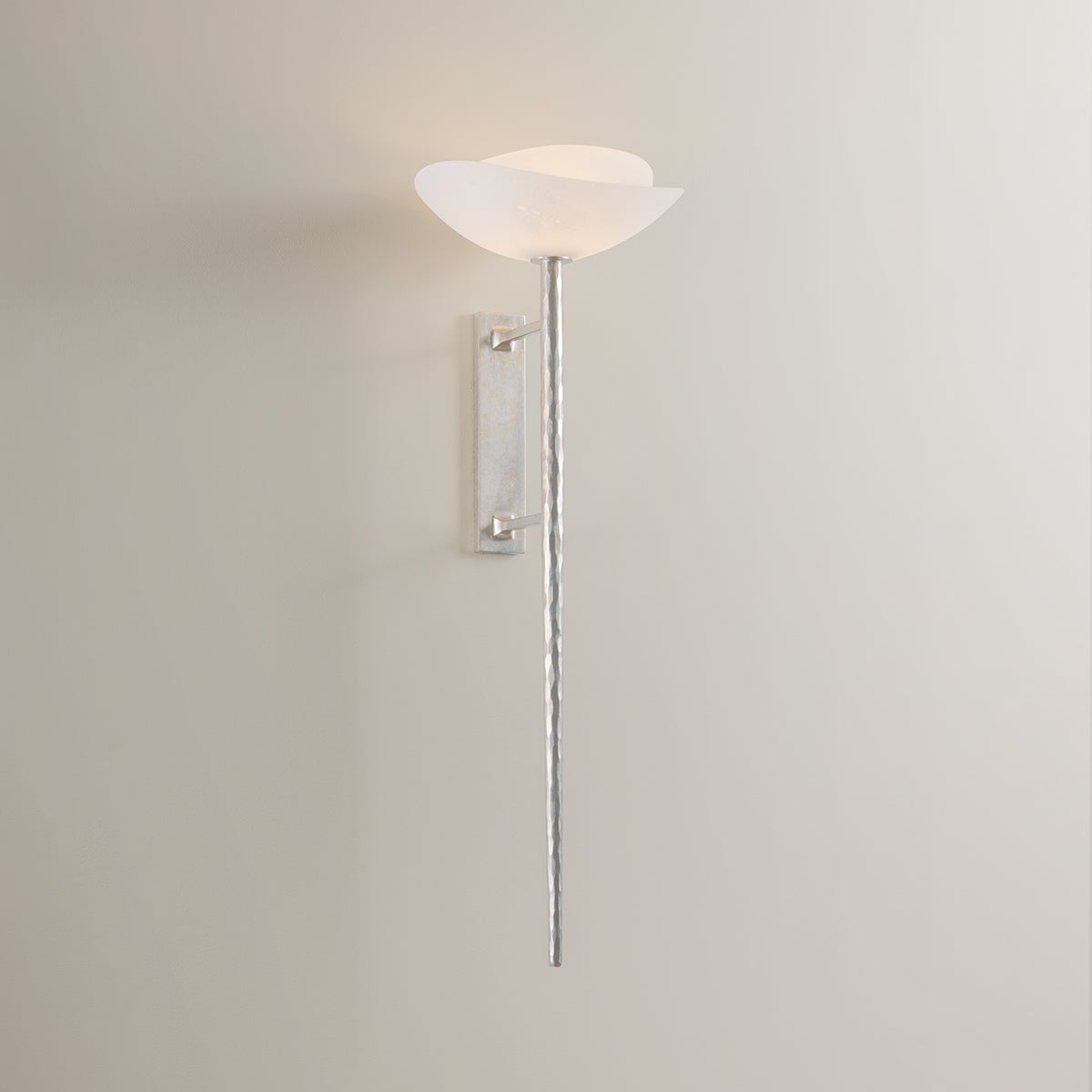 Close-up of the Coppa Wall Sconce showing the arm curve and shade silhouette.