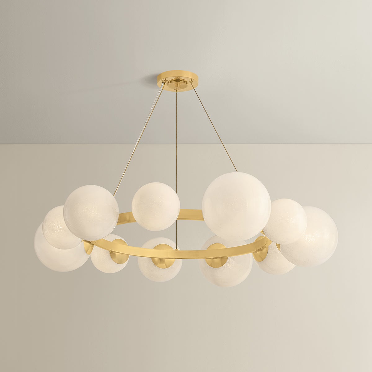 Close-up of the Pacama Chandelier 40.25" in aged brass showing the frame, arms, and shade detail.