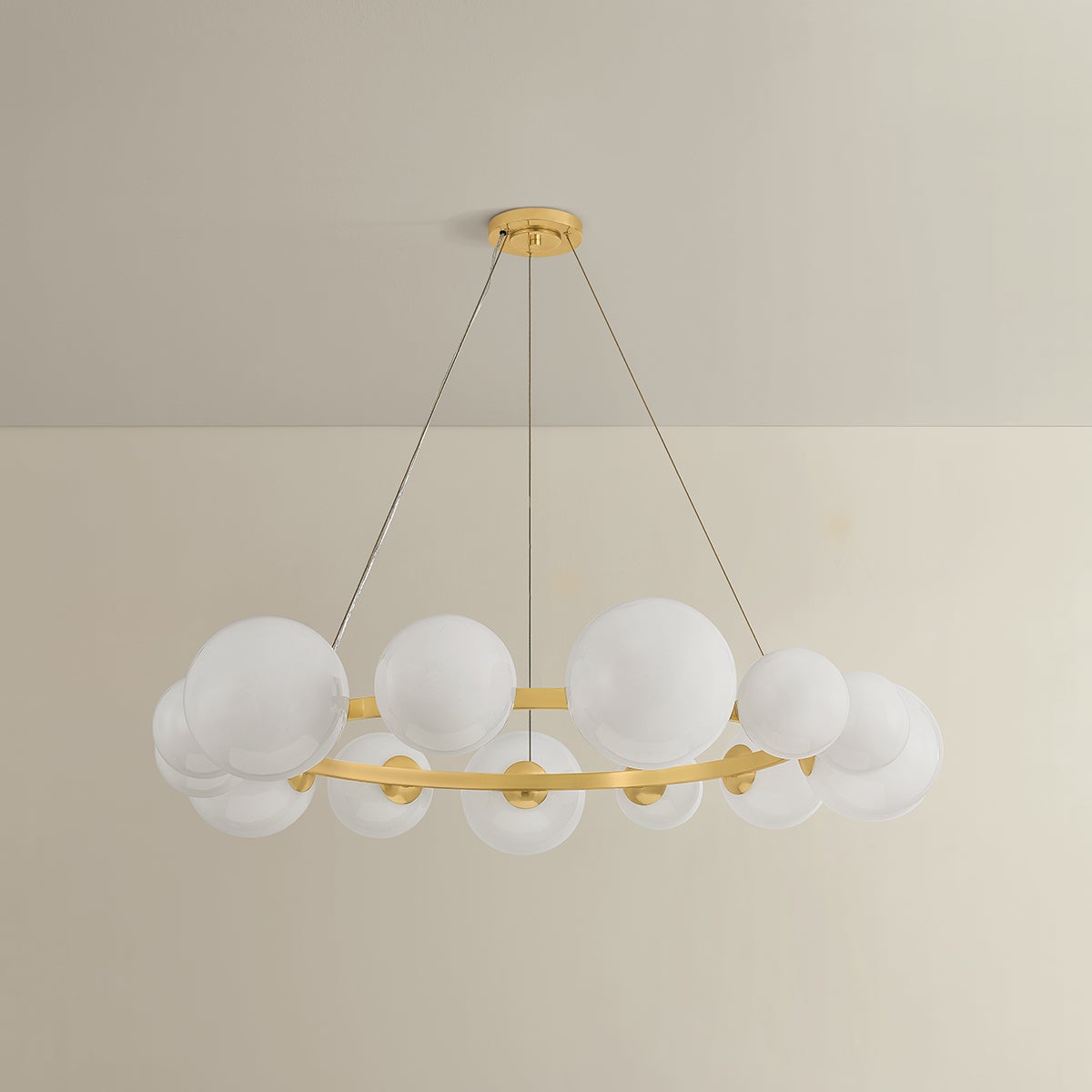 Pacama Chandelier 55" in aged brass shown from the front to reveal the frame, arms, and shade detail.