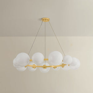 Pacama Chandelier 55" in aged brass shown from the front to reveal the frame, arms, and shade detail.