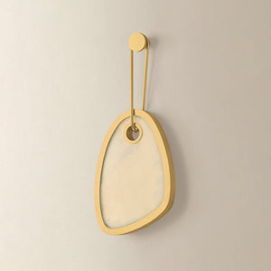 Vela Wall Sconce shown from the front to reveal the arm curve and shade silhouette.