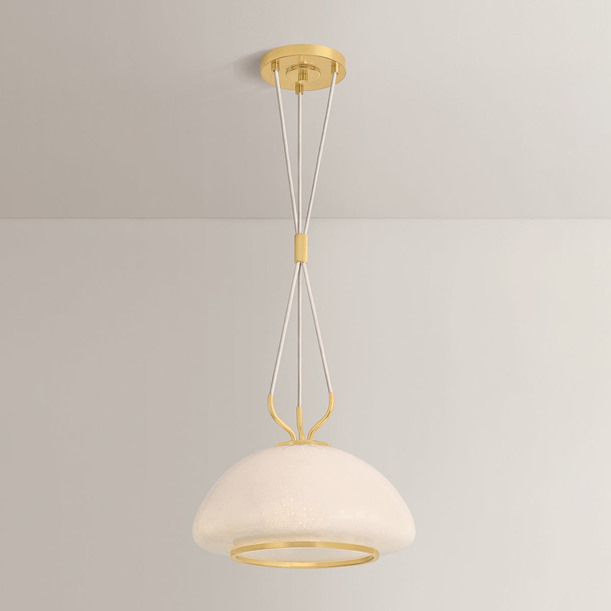 Baudette Pendant 14.25" in aged brass shown from the front to reveal the shade shape and metal detail.