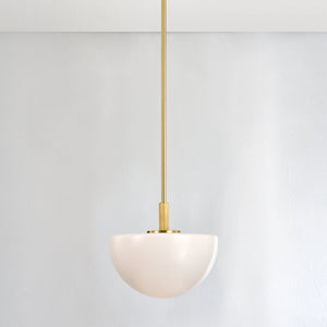 Close-up of the Lethbridge Pendant 15" in aged brass showing the shade shape and metal detail.