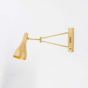 Close-up of the Northford Wall Sconce in aged brass showing the arm curve and shade silhouette.