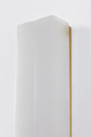 Bremsen Wall Sconce 5" x 24.5" in aged brass shown from the front to reveal the arm curve and shade silhouette.