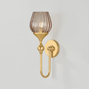 Chatton Wall Sconce in aged brass shown from the front to reveal the arm curve and shade silhouette.