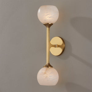 Close-up of the Melton Wall Sconce 2-Light 5" x 18.5" in aged brass showing the arm curve and shade silhouette.