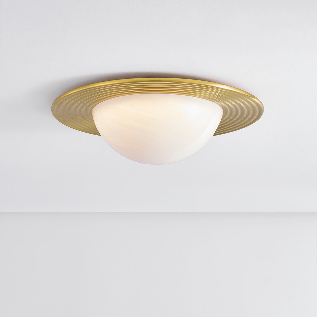 Close-up of the Geraldton Flush Mount 21" in aged brass showing the shade profile and mounting canopy.