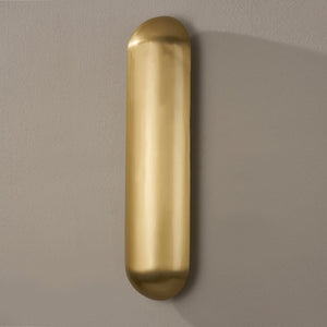 Wheeler Wall Sconce in aged brass shown from the front to reveal the arm curve and shade silhouette.