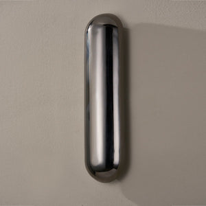 Close-up of the Wheeler Wall Sconce showing the arm curve and shade silhouette.
