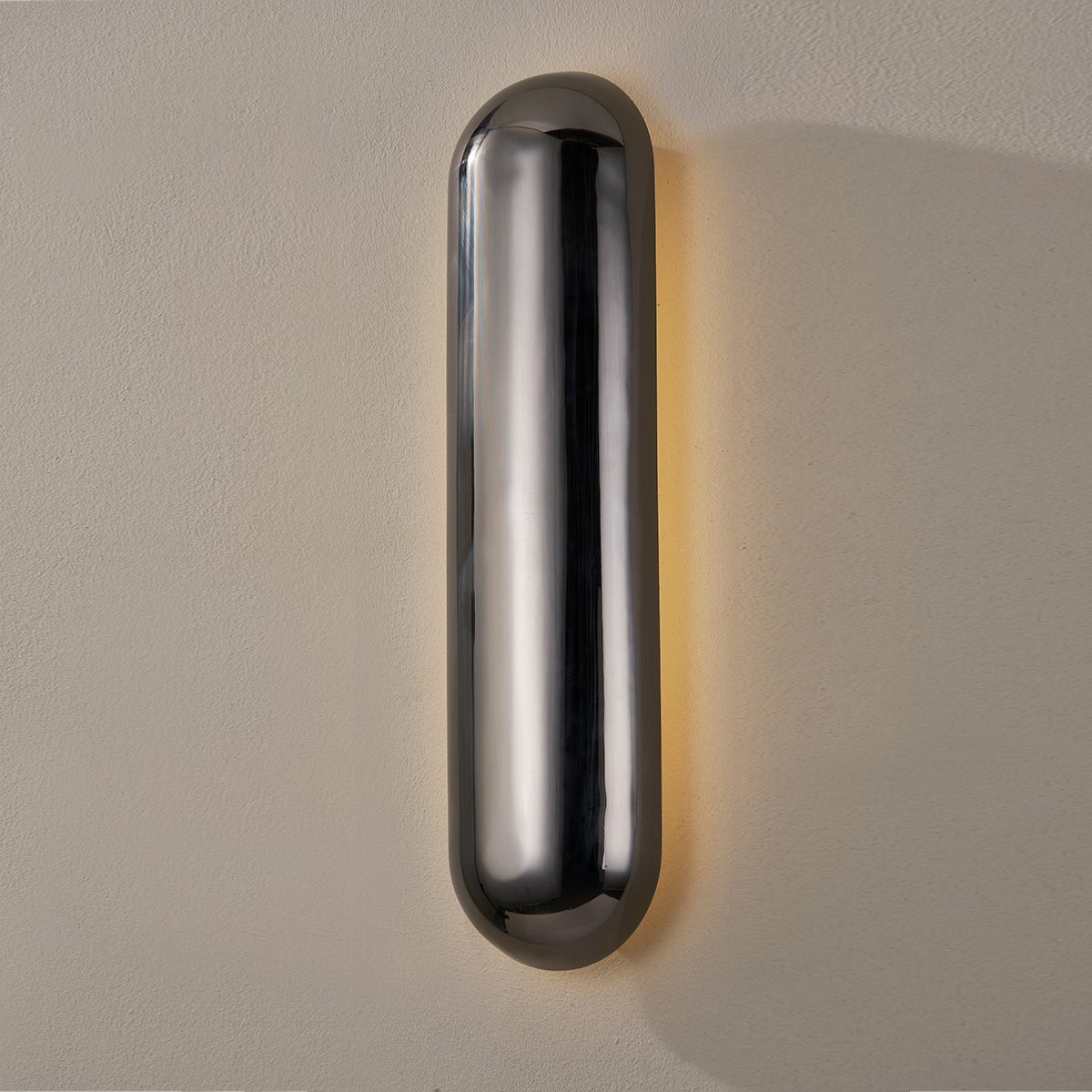 Close-up of the Wheeler Wall Sconce showing the arm curve and shade silhouette.