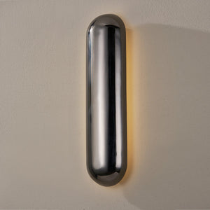 Close-up of the Wheeler Wall Sconce showing the arm curve and shade silhouette.