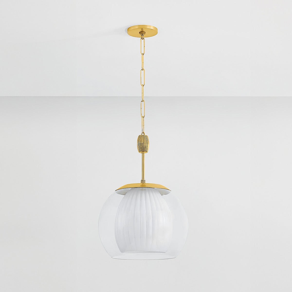 Clementon Pendant 17" in aged brass shown from the front to reveal the shade shape and metal detail.